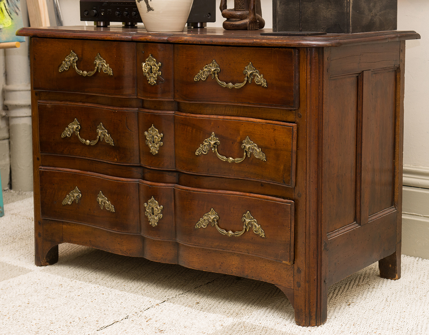 Appraisal: A FRENCH SERPENTINE FRONTED THREE DRAWER CHEST WITH ORNATE BRASS