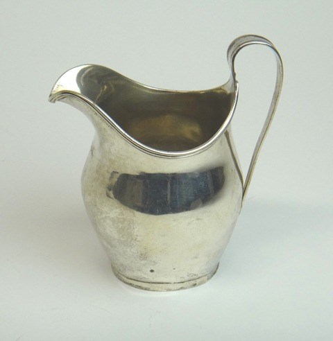 Appraisal: A late Victorian silver helmet shaped milk jug in the