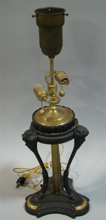 Appraisal: EMPIRE STYLE TABLE LAMP Formed as a bronze tripod casssoulette