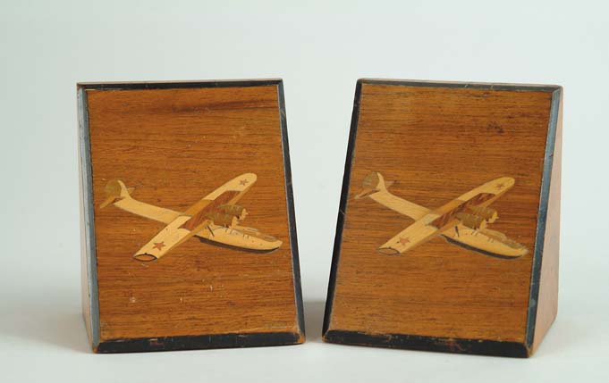 Appraisal: PAIR OF INLAID MAHOGANY FLYING BOAT BOOKENDS Wedge shaped with