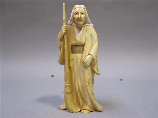 Appraisal: JAPANESE IVORY OKIMONO OF A ROBED MAN th C holding