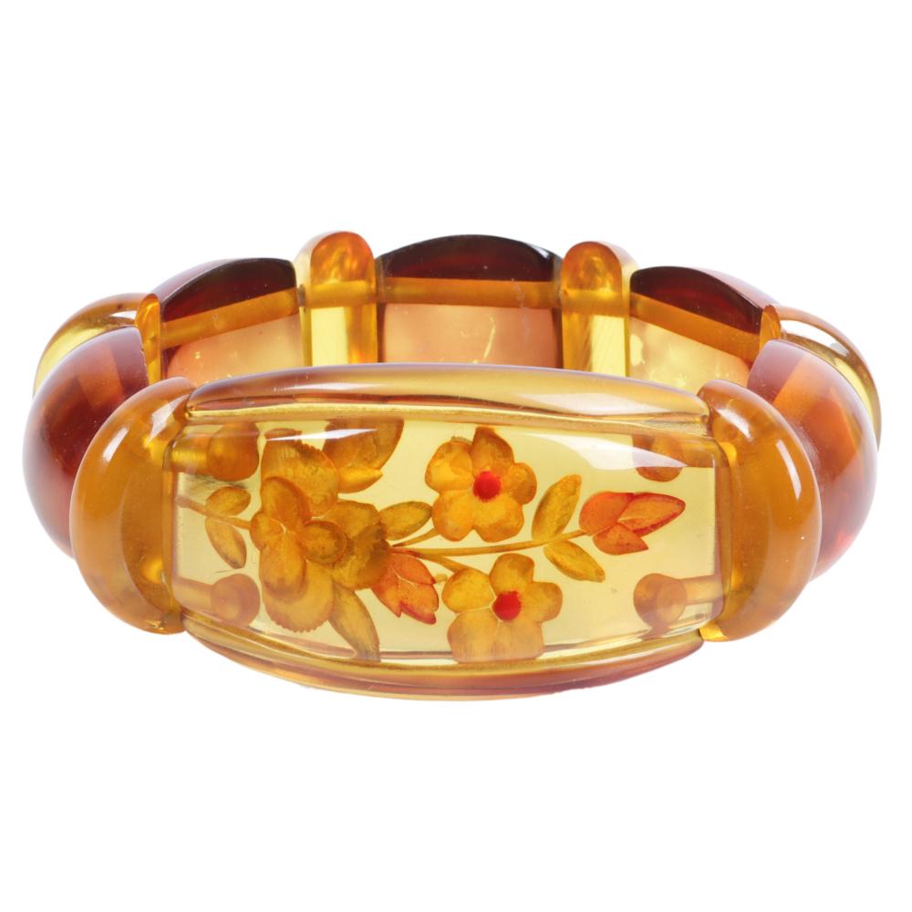 Appraisal: REVERSE CARVED APPLE JUICE BAKELITE STRETCH FLORAL BRACELET H X