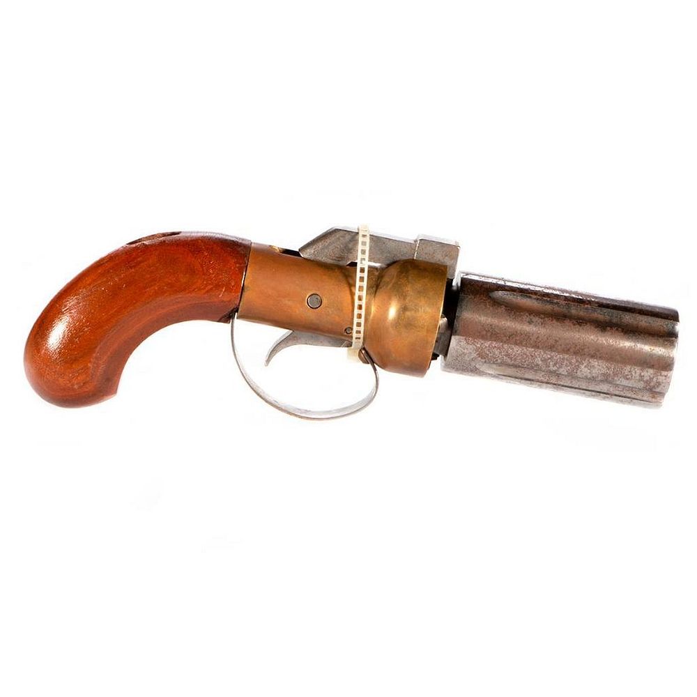 Appraisal: A four barrel pistol A four-shot revolving barrel pistol measuring