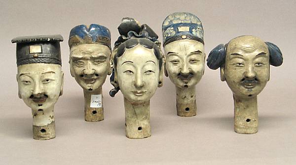 Appraisal: A group of five stoneware puppet heads Including one female