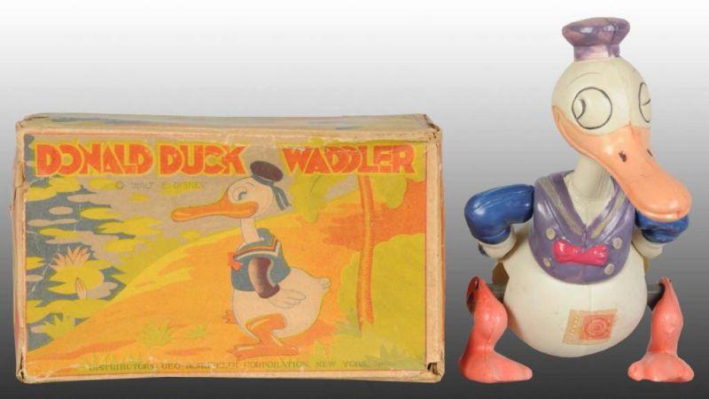 Appraisal: Walt Disney Celluloid Donald Duck Waddler Toy Description Includes original