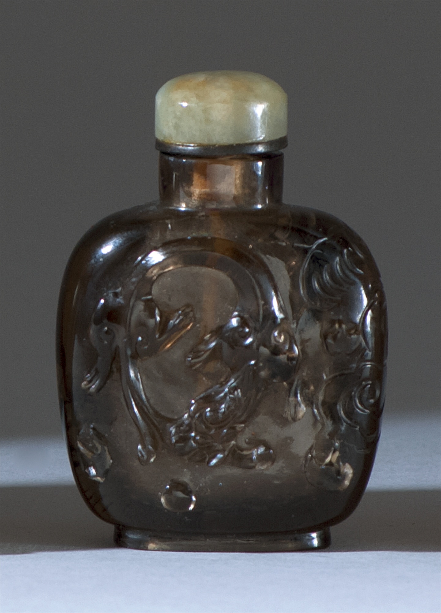 Appraisal: SMOKY QUARTZ SNUFF BOTTLE Circa In spade shape with relief