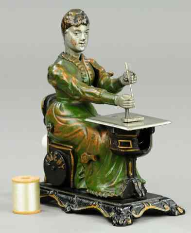 Appraisal: CAST IRON WOMAN AT SEWING MACHINE Attributed to Sandt Pat