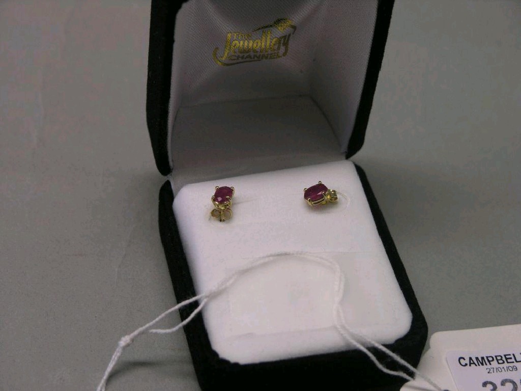 Appraisal: A pair of gold and ruby ear studs in box