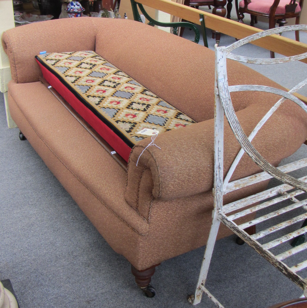 Appraisal: A Victorian Chesterfield sofa on turned walnut supports cm wide