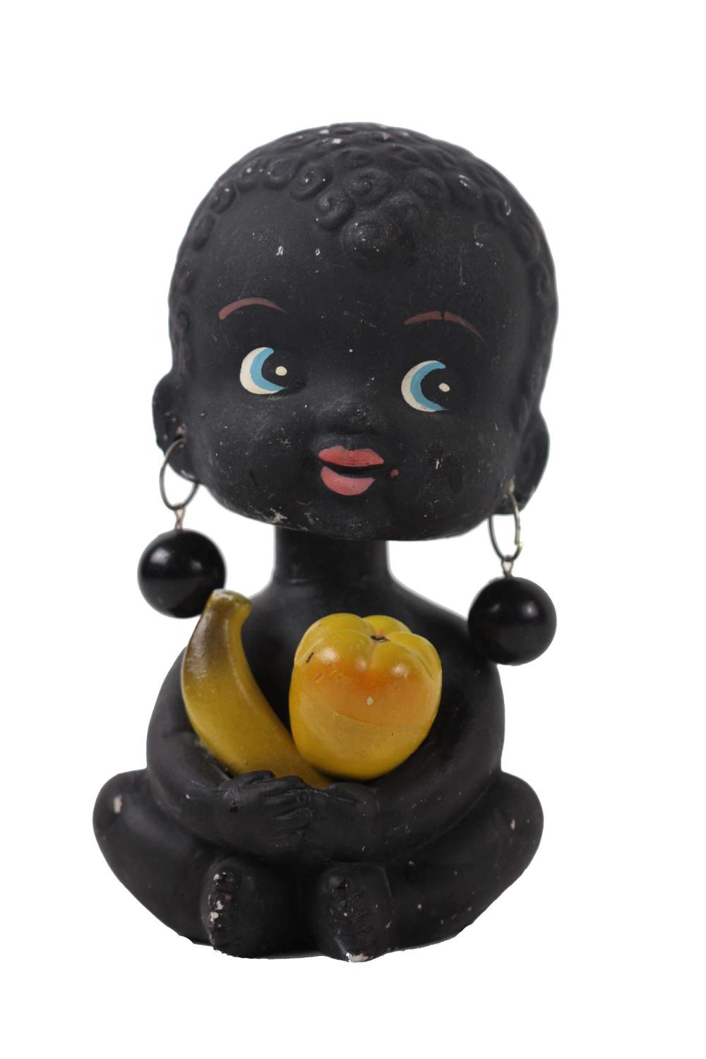 Appraisal: VINTAGE BLACK AMERICANA BOBBLE-HEAD CHALKWARE BANKChild with fruit Height in