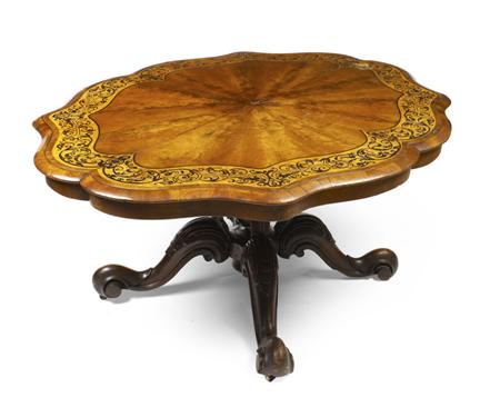 Appraisal: A Victorian mahogany and inlaid breakfast table the shaped top