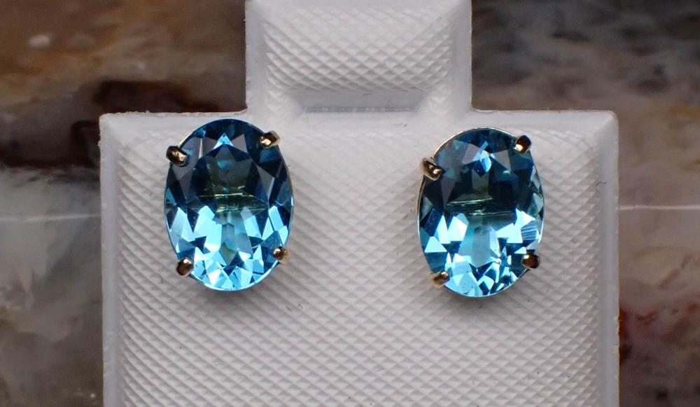 Appraisal: PAIR OF BLUE TOPAZ AND FOURTEEN KARAT GOLD EAR STUDS