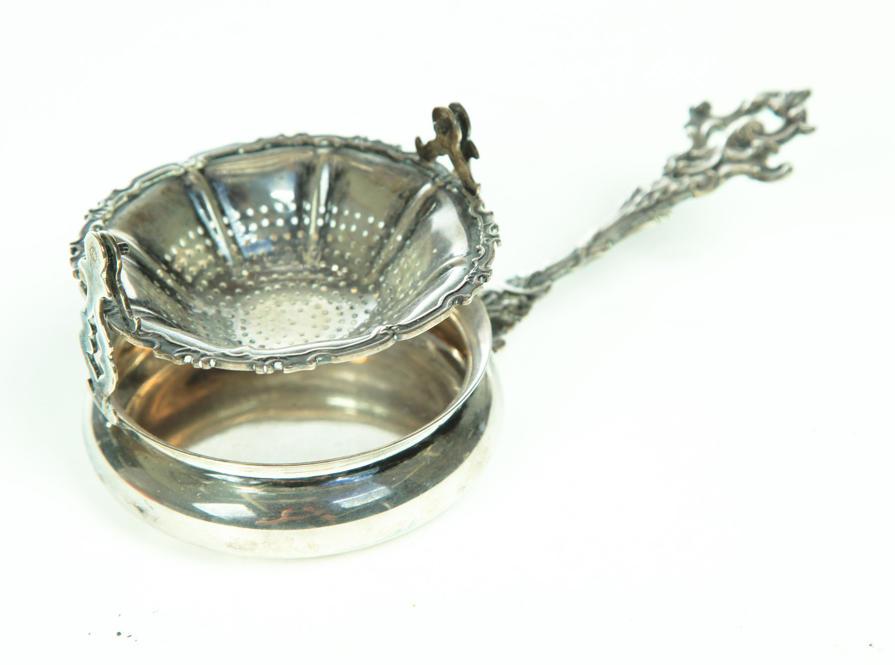 Appraisal: SILVER TEA STRAINER American late th century sterling silver Unusual