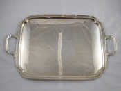 Appraisal: A two handled rectangular silver tray with re-entrant corners Sheffield