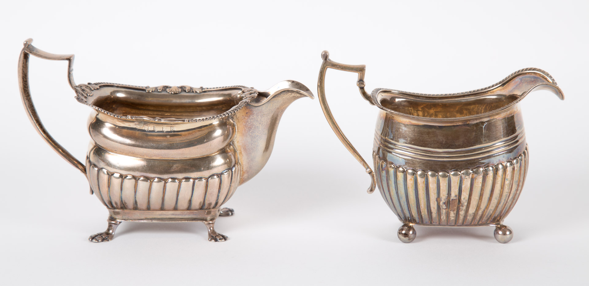 Appraisal: Two Georgian sterling silver cream pitchers th century no maker's