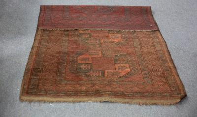 Appraisal: A Turkoman rug with three geometric medallions to the red