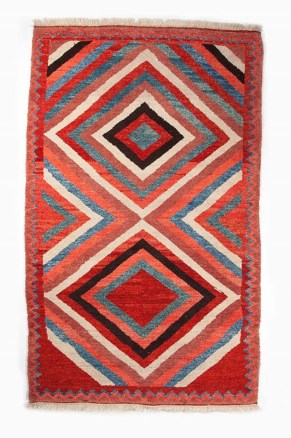 Appraisal: A PERSIAN GABBEH decorated twin concentric red white black and