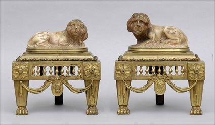 Appraisal: PAIR OF ITALIAN GILT-BRONZE AND CARVED MARBLE CHENETS Each carved