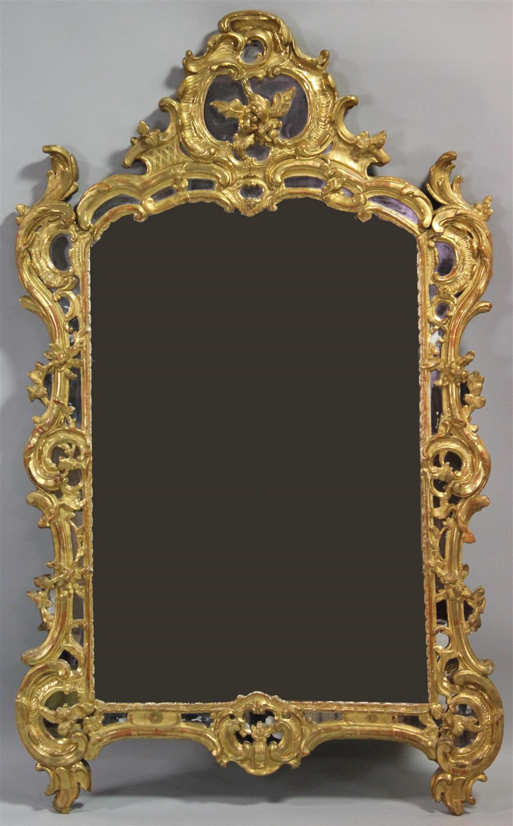 Appraisal: LARGE LOUIS XV STYLE GILTWOOD MIRROR in the rococo manner