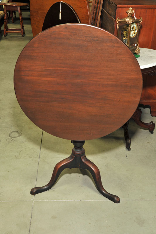 Appraisal: TILT TOP TEA TABLE Walnut with a round top urn