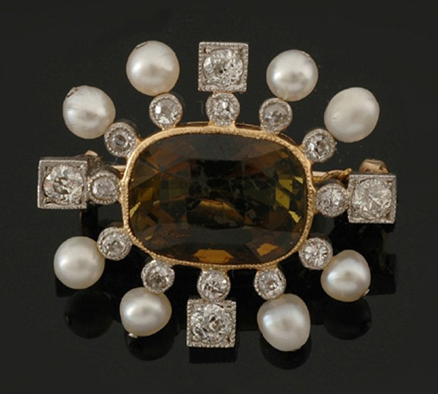 Appraisal: An Edwardian andalusite diamond and seed pearl brooch The central