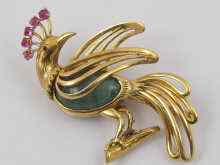 Appraisal: A French hallmarked ct gold emerald and ruby brooch in