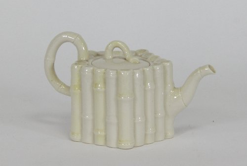 Appraisal: A Belleek faux bamboo teapot of hexagonal shape black printed