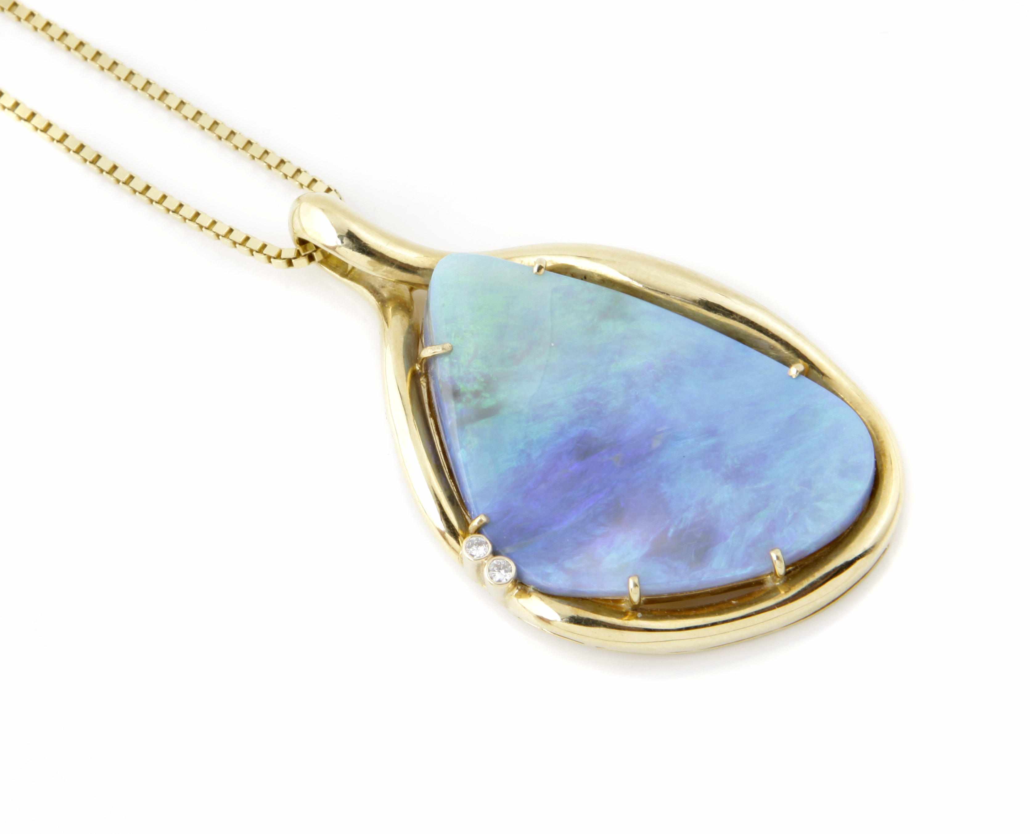 Appraisal: An opal diamond and k gold pendant with an k