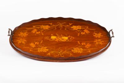 Appraisal: An Edwardian mahogany oval tray inlaid a central vignette of