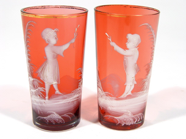 Appraisal: Two Mary Gregory cranberry glass beakers enamelled with children in