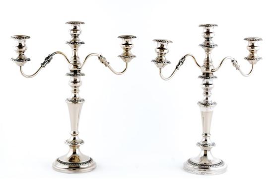 Appraisal: Pair American silverplate three-light candelabra gadroon bobeche on scrolling arms