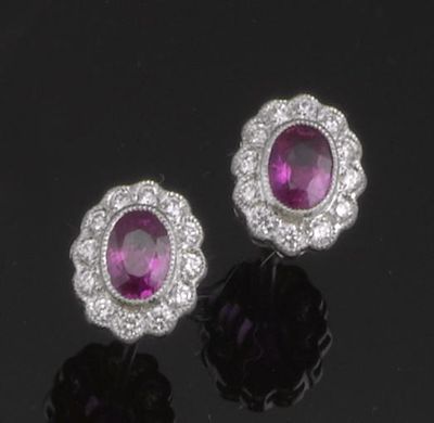 Appraisal: A pair of ruby and diamond cluster earrings Set in