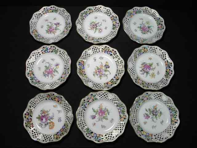 Appraisal: Nine floral reticulated porcelain plates hand painted with a floral