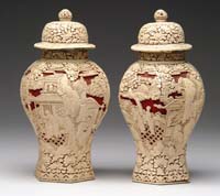 Appraisal: PAIR OF CINNABAR COVERED JARS Six paneled sides are white