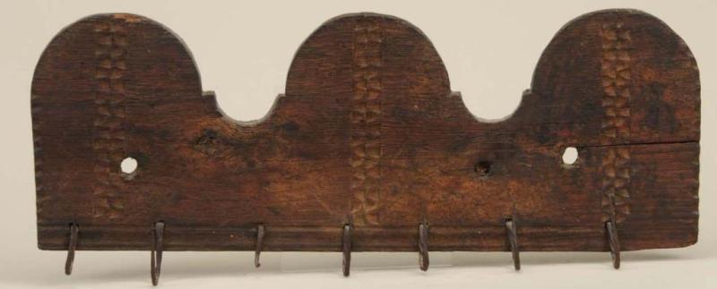 Appraisal: Carved Oak Iron Utensil Hanger Description th Century Losses to