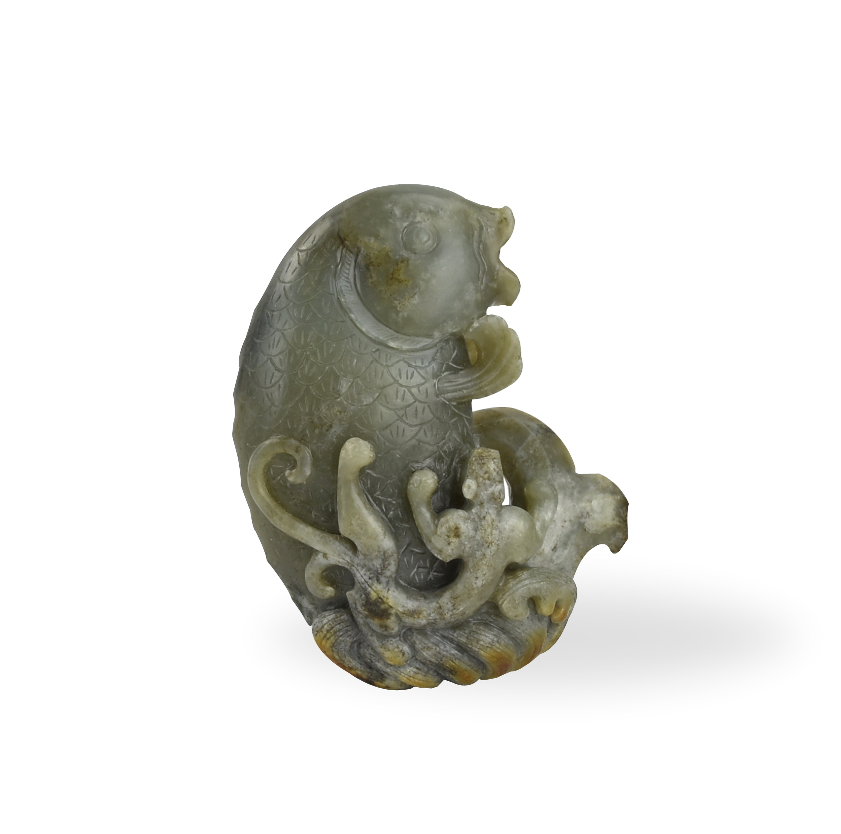 Appraisal: a Greenish jadeite carving molded in a fish form with