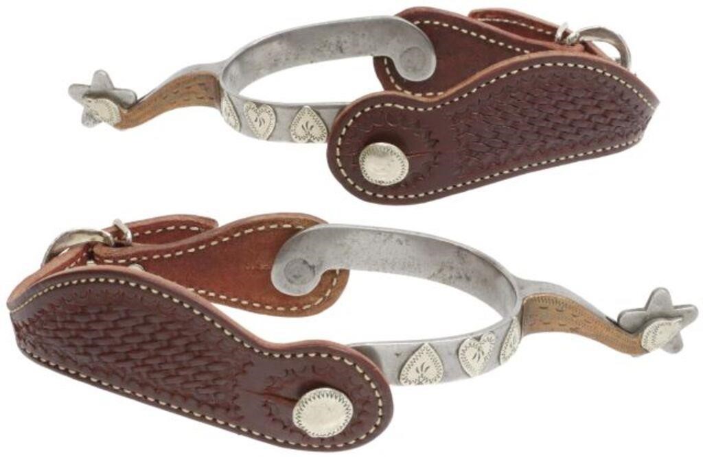 Appraisal: pair Western cowboy spurs outside heelband with heart-shaped mounts rowels