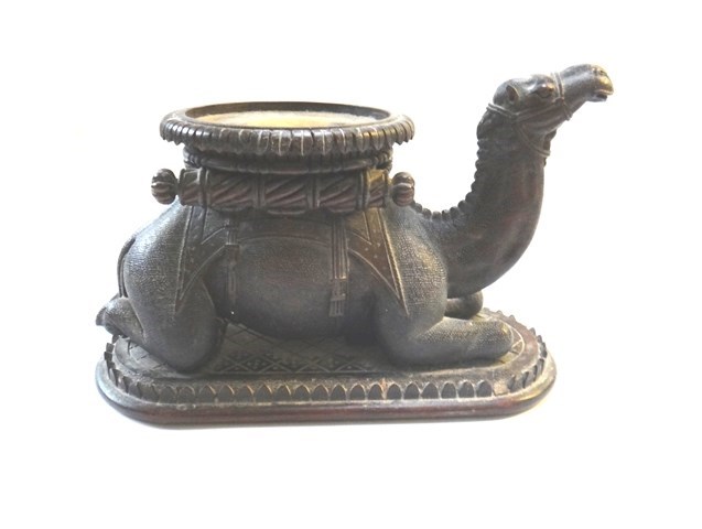 Appraisal: A hardwood carved camel circa modelled on knees and hind