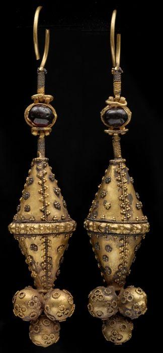 Appraisal: TWO ANCIENT-STYLE TEMPLE ORNAMENTS WITH CABOCHON STONES in Provenance Property