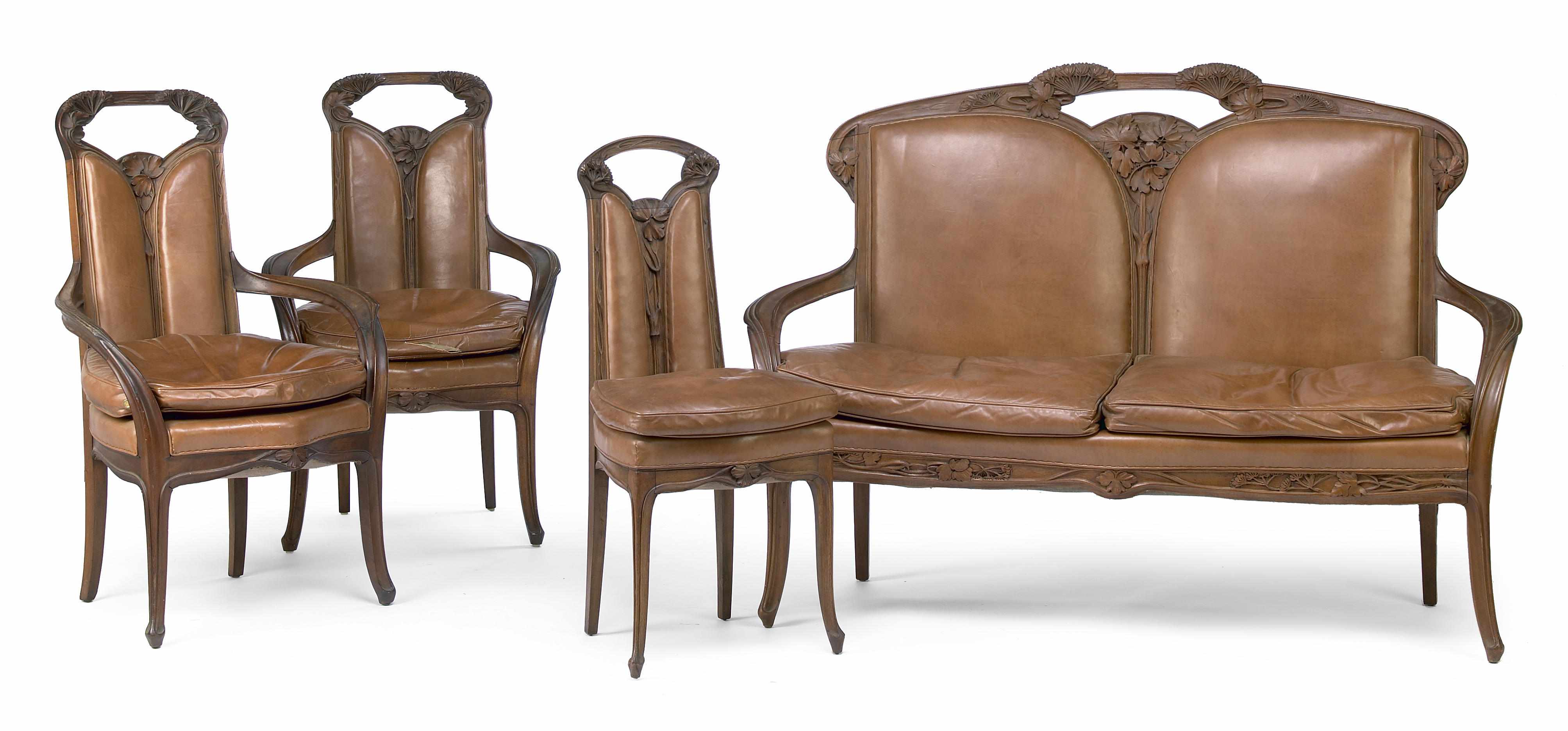 Appraisal: An Art Nouveau style walnut four piece salon suite after