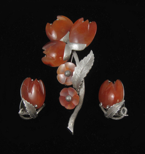 Appraisal: THREE ARTICLES OF CARNELIAN AND SILVER JEWELRY including a silver