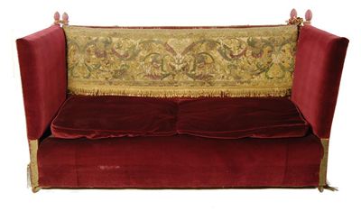 Appraisal: A Knole settee with burgundy velvet upholstery the back with