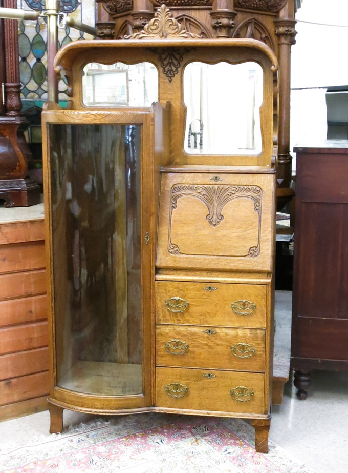 Appraisal: LATE VICTORIAN OAK SECRETARY CHINA CABINET Forest City Furniture Co