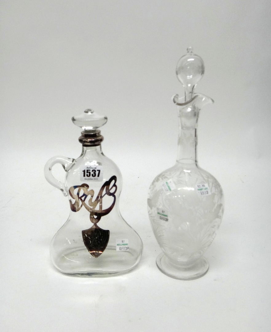 Appraisal: A glass moulded bell shaped decanter and stoper detailed Rye