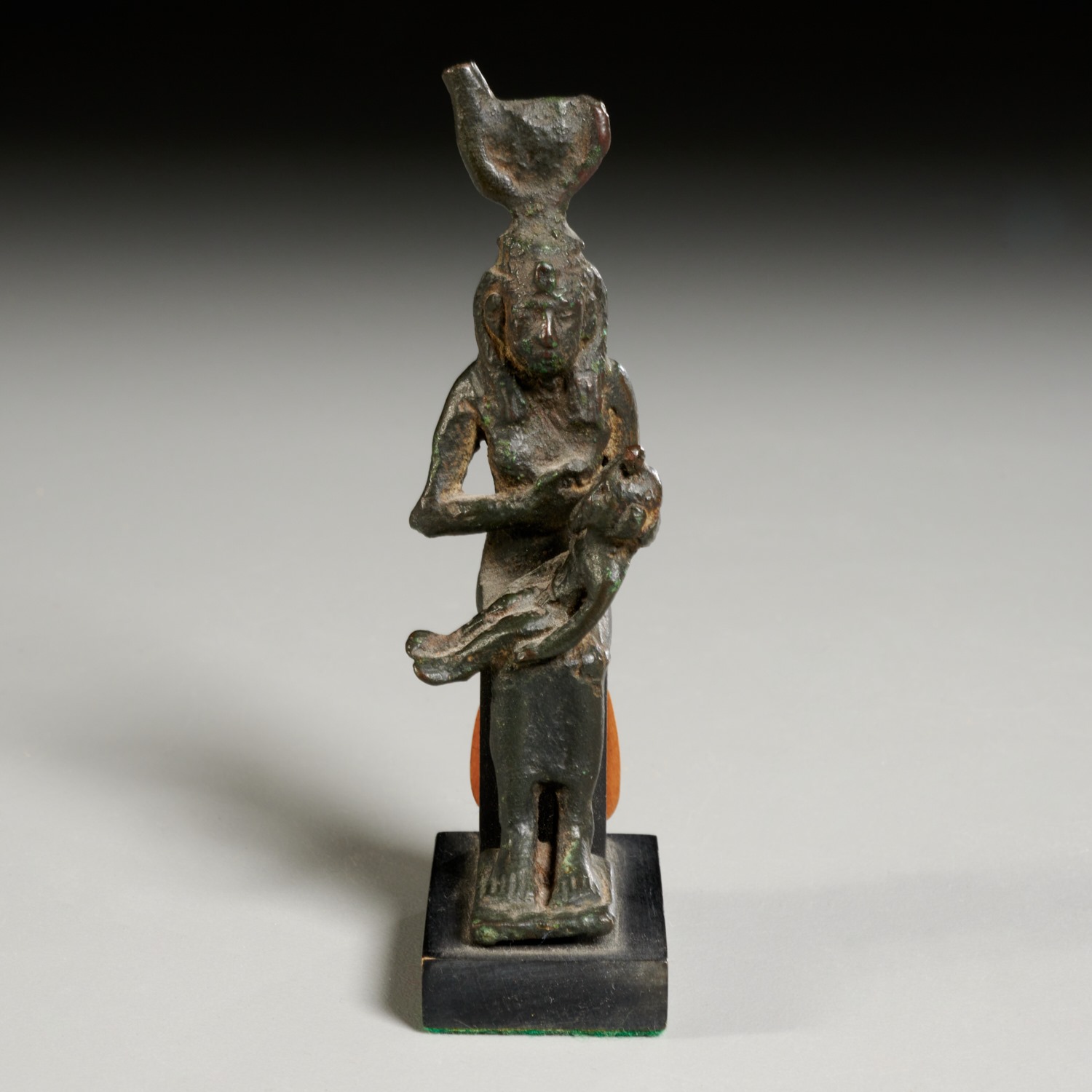 Appraisal: ANCIENT EGYPTIAN BRONZE STATUETTE OF ISIS c BCE - BCE