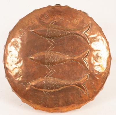 Appraisal: A Newlyn School copper shield embossed three fish cm diameter