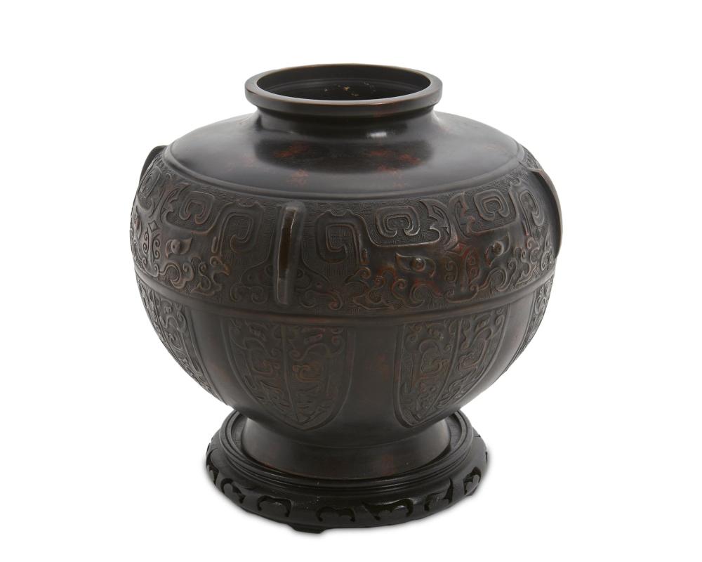 Appraisal: A Chinese bronze jardini re with stand th Century With