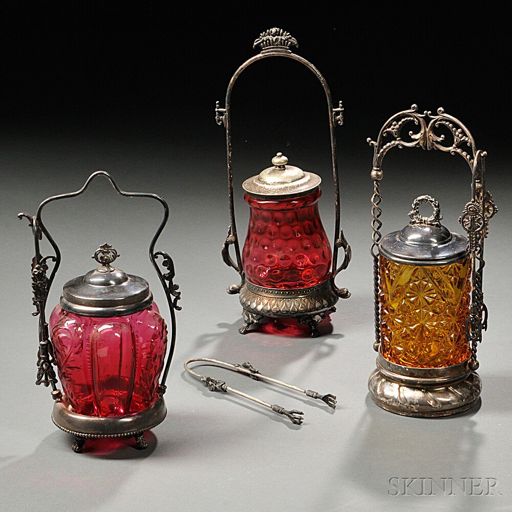 Appraisal: Three Pickle Casters America late th century cranberry thumbprint glass