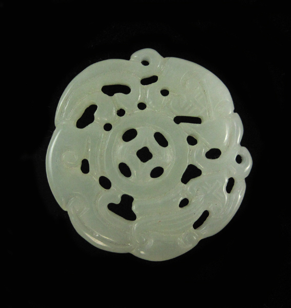 Appraisal: LIGHT GREEN HARDSTONE PENDANT The round translucent light green hardstone