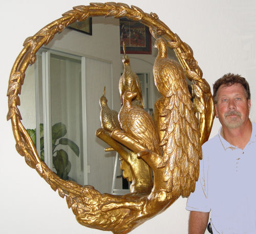 Appraisal: OUTRAGEOUS GILT PEACOCK MIRROR Silver and gold gilt carved wood